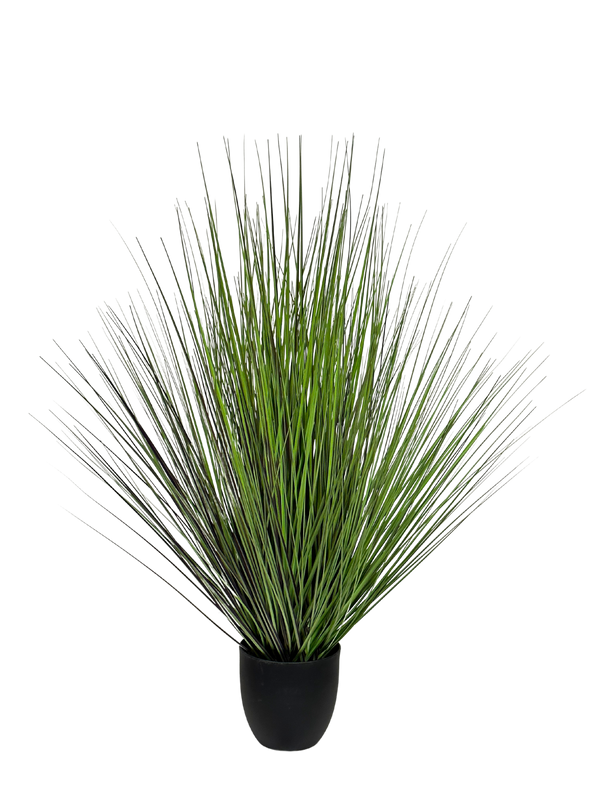 A artificial grass puppet with a bunch of swaying strands forming a plant-like shape, in a green color.